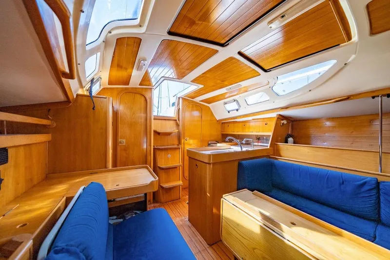 Slide: The Image of Bathroom interior of 1992 Beneteau Oceanis 350 yacht, featuring sink, mirror, and toilet. - 7