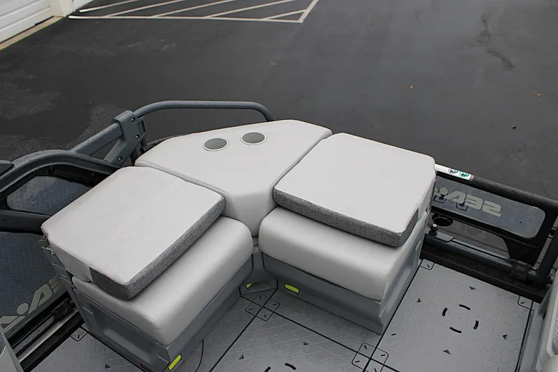 Slide: The Image of 2023 Sea-Doo Switch Cruise 21 seating area with gray cushions and cup holders. - 13