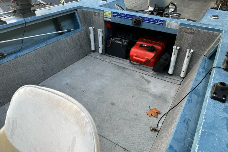 Slide: The Image of 1998 Klamath 18 Open boat interior with fuel tank and seating. - 10