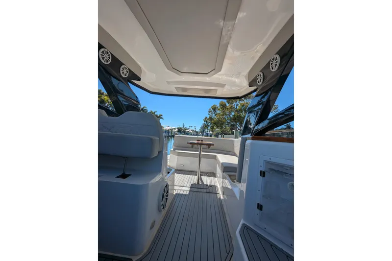 Slide: The Image of Interior view of 2023 NX Boats 340 Sport Coupe, featuring sleek design and modern amenities. - 100