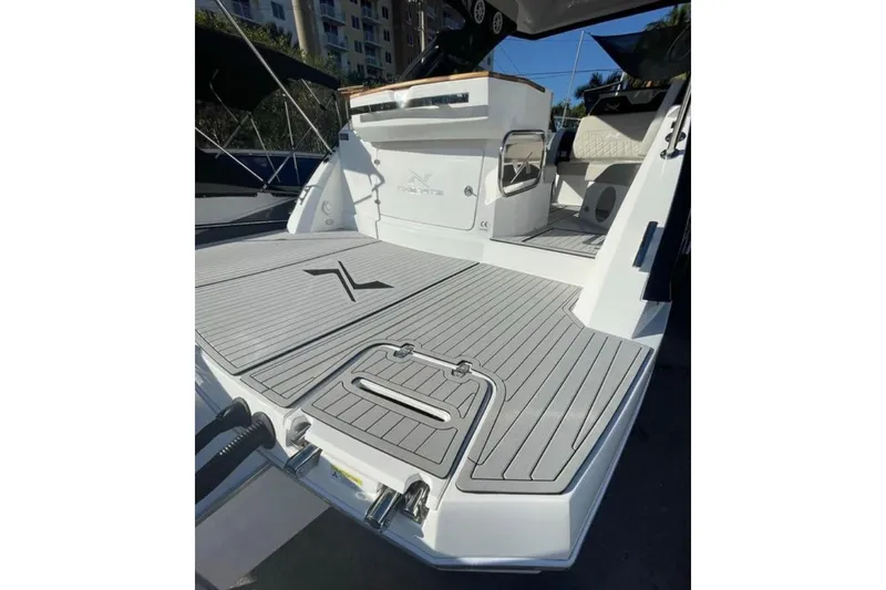 Slide: The Image of 2023 NX Boats 340 Sport Coupe, sleek deck design, modern features, luxury yacht. - 17
