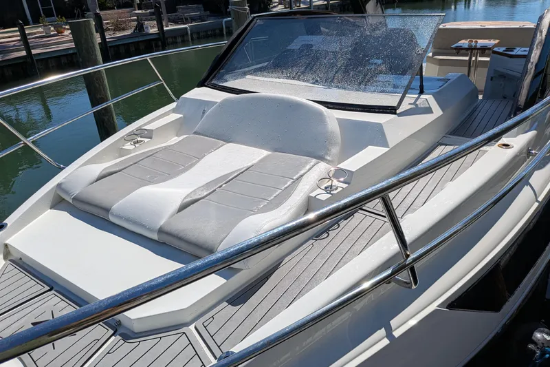 Slide: The Image of 2023 NX Boats 340 Sport Coupe with sleek deck and comfortable seating. - 41