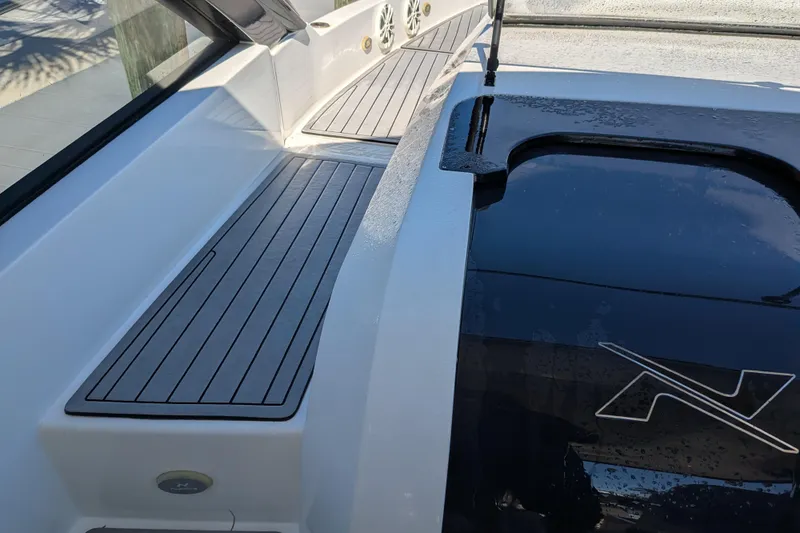 Slide: The Image of 2023 NX Boats 340 Sport Coupe deck with sleek design and modern features. - 74