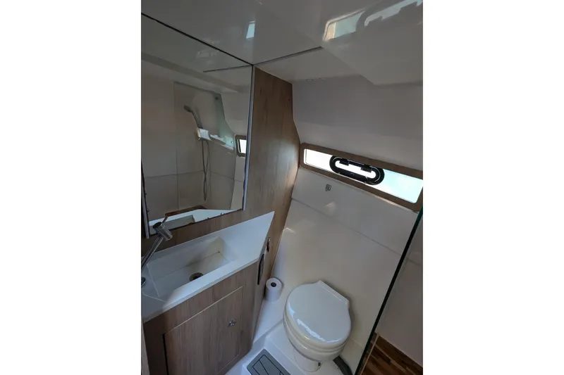Slide: The Image of 2023 NX Boats 340 Sport Coupe bathroom with modern fixtures and sleek design. - 95