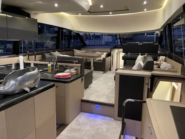 Slide: The Image of Luxurious interior of a 2017 Prestige 500 yacht with modern furnishings and ambient lighting. - 1