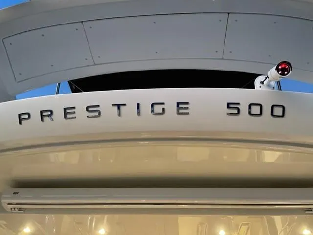 Slide: The Image of 2017 Prestige 500 yacht, rear view with model name displayed prominently. - 11