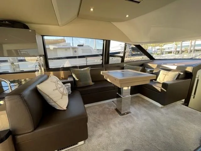 Slide: The Image of Luxurious interior of a 2017 Prestige 500 yacht with elegant seating and modern decor. - 18