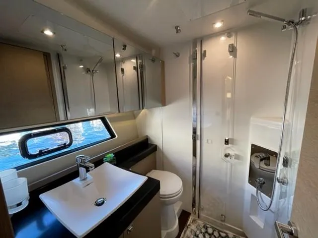 Slide: The Image of Luxurious bathroom in 2017 Prestige 500 yacht with modern fixtures and ocean view. - 31