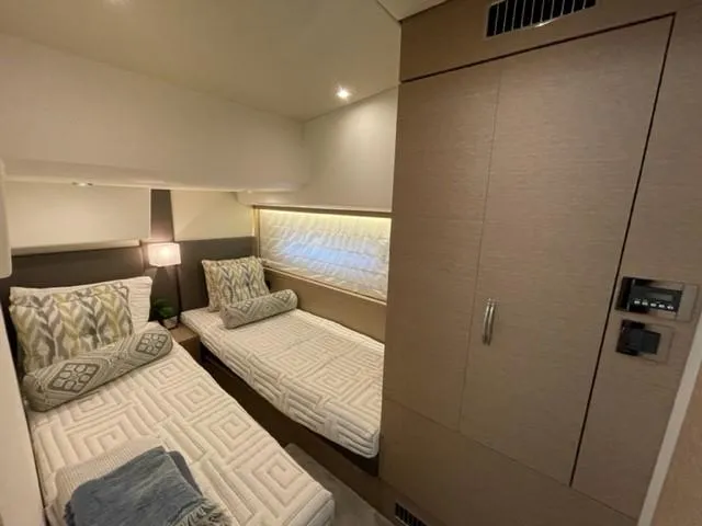 Slide: The Image of Luxurious twin cabin in 2017 Prestige 500 yacht, featuring modern decor and ambient lighting. - 33