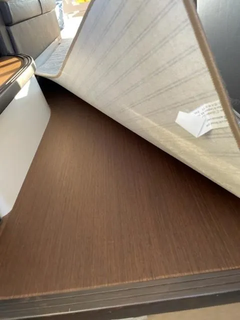 Slide: The Image of Interior view of a 2017 Prestige 500 yacht, showcasing under-seat storage space. - 35