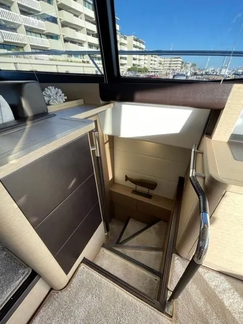 Slide: The Image of Interior of 2017 Prestige 500 yacht with modern staircase and cabinetry. - 36