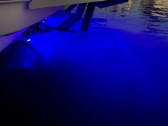 Slide: The Image of Underwater blue lights on a 2017 Prestige 500 yacht at night. - 9