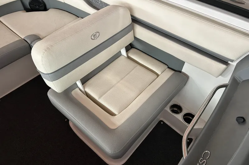Slide: The Image of 2021 Cobalt CS22 boat interior with beige and gray seating. - 14