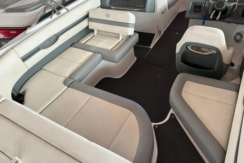 Slide: The Image of Interior of a 2021 Cobalt CS22 boat with gray and white seating. - 15