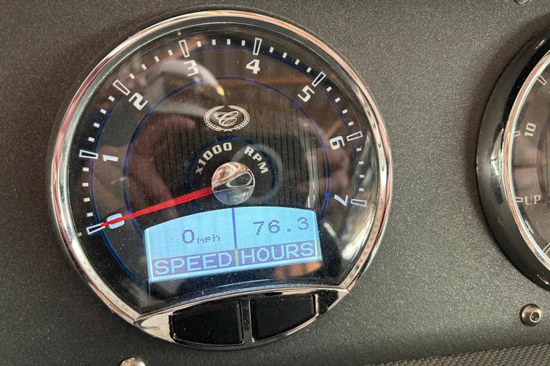 Slide: The Image of Tachometer of 2021 Cobalt CS22 showing 0 mph and 76.3 hours. - 18