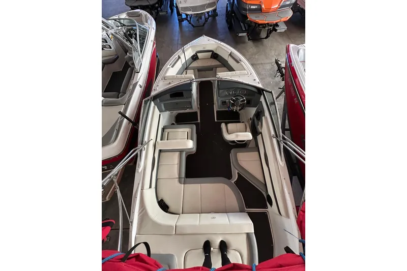 Slide: The Image of 2021 Cobalt CS22 boat interior with sleek seating and modern dashboard design. - 9