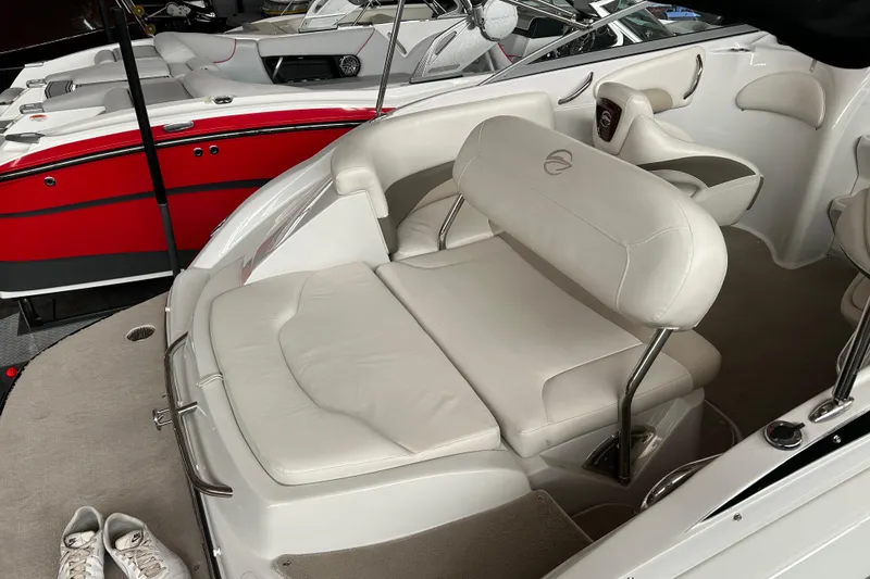 Slide: The Image of 2008 Crownline 230 CCR boat interior with white leather seating and modern design. - 10