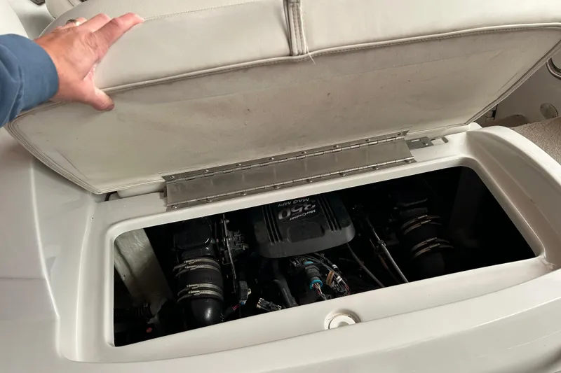 Slide: The Image of Open engine compartment of 2008 Crownline 230 CCR boat, showing engine details. - 13