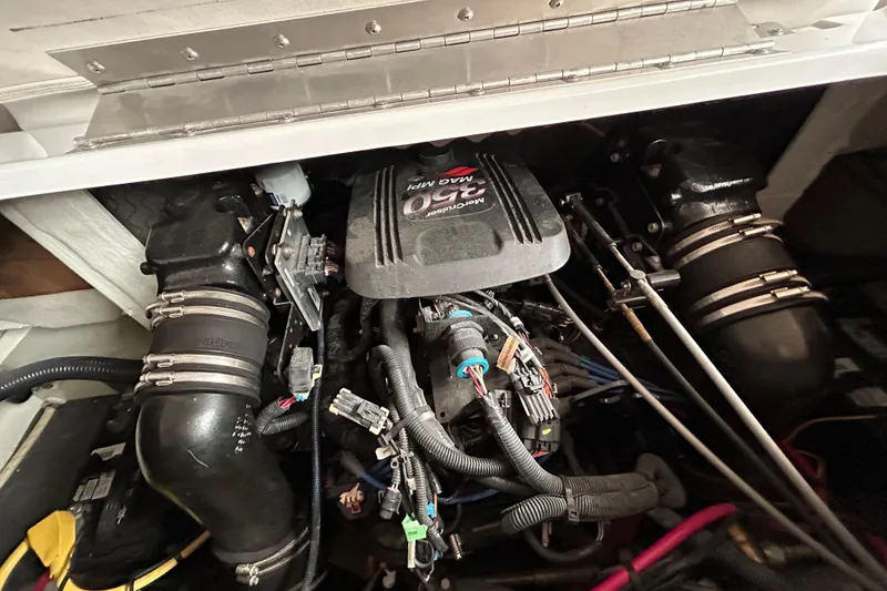 Slide: The Image of Engine compartment of 2008 Crownline 230 CCR boat, featuring a MerCruiser 350 MAG MPI engine. - 14