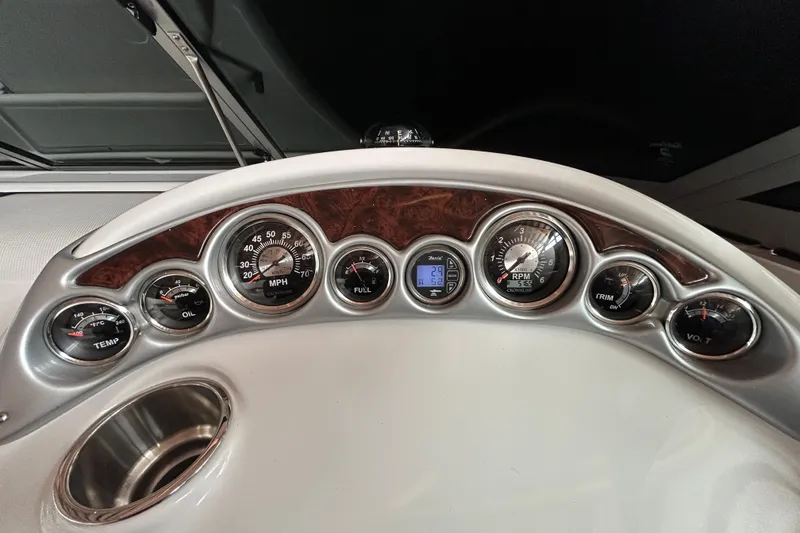 Slide: The Image of Dashboard of a 2008 Crownline 230 CCR boat with various gauges and controls. - 15