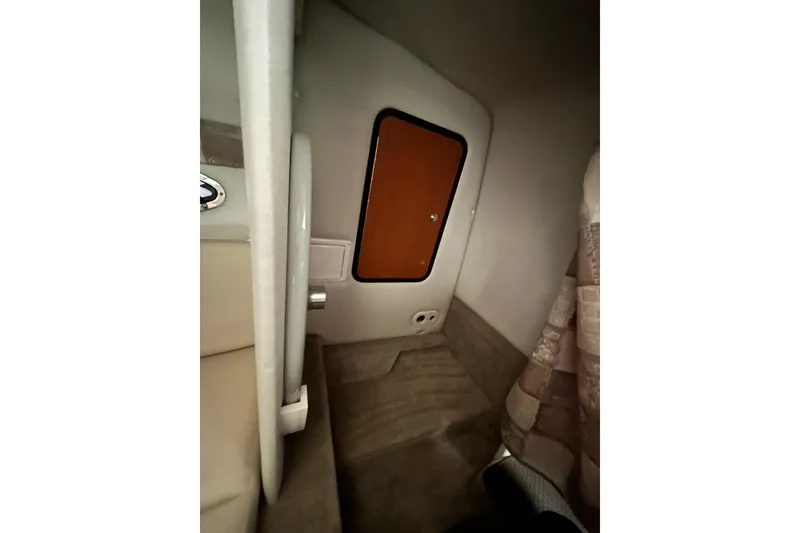 Slide: The Image of Interior cabin of 2008 Crownline 230 CCR boat, featuring seating and storage. - 20