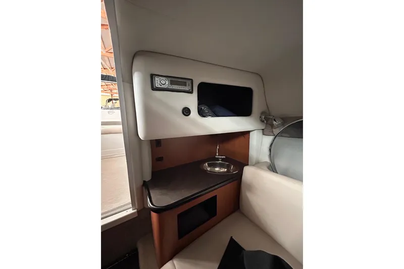 Slide: The Image of Interior of 2008 Crownline 230 CCR boat with sink and storage area. - 21