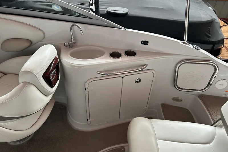 Slide: The Image of 2008 Crownline 230 CCR boat interior with sink and seating area. - 7