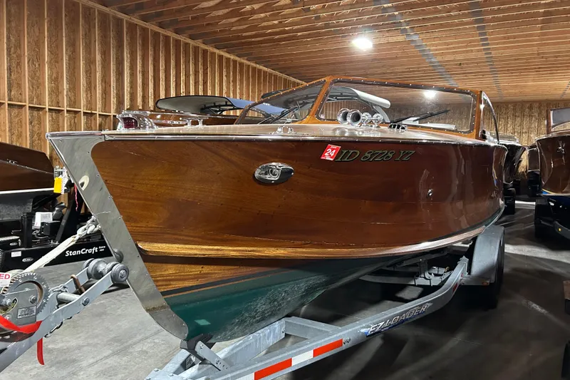 Slide: The Image of 2010 StanCraft 27 Lowboy wooden boat on trailer in a wooden garage. - 3