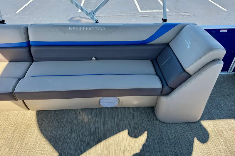 Slide: The Image of 2023 Bennington 23 SX boat seating with gray and blue upholstery. - 25