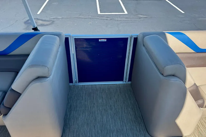 Slide: The Image of Interior seating of 2023 Bennington 23 SX pontoon boat with blue accents. - 29