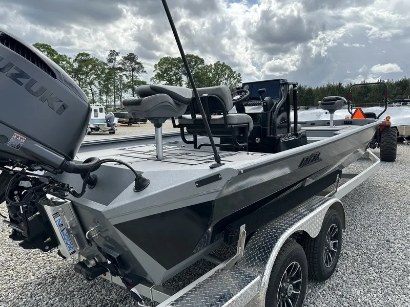 Slide: The Image of 2026 Excel 230 Bay Pro boat on trailer, Suzuki engine. - 6