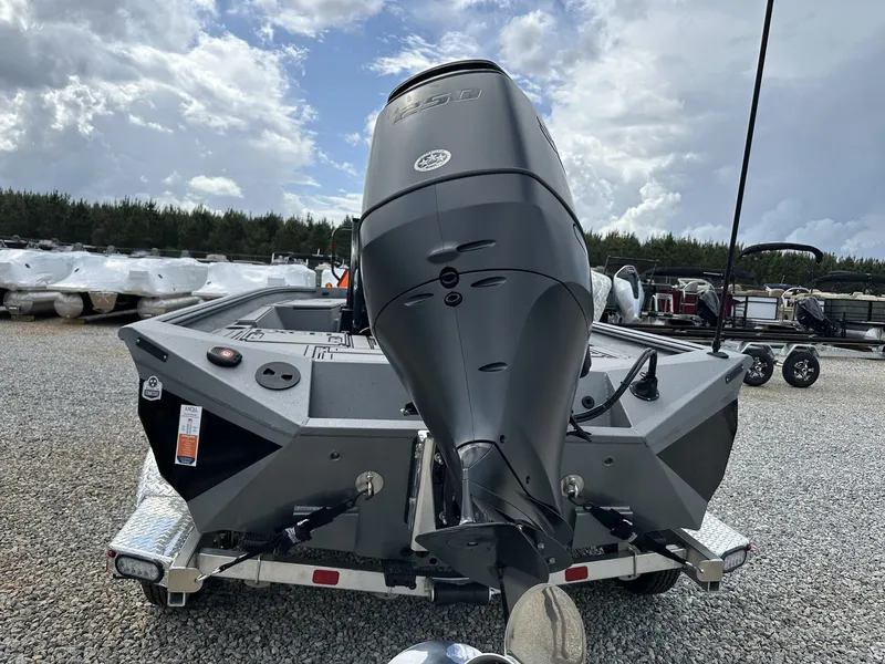 Slide: The Image of 2026 Excel 230 Bay Pro boat with outboard motor. - 7