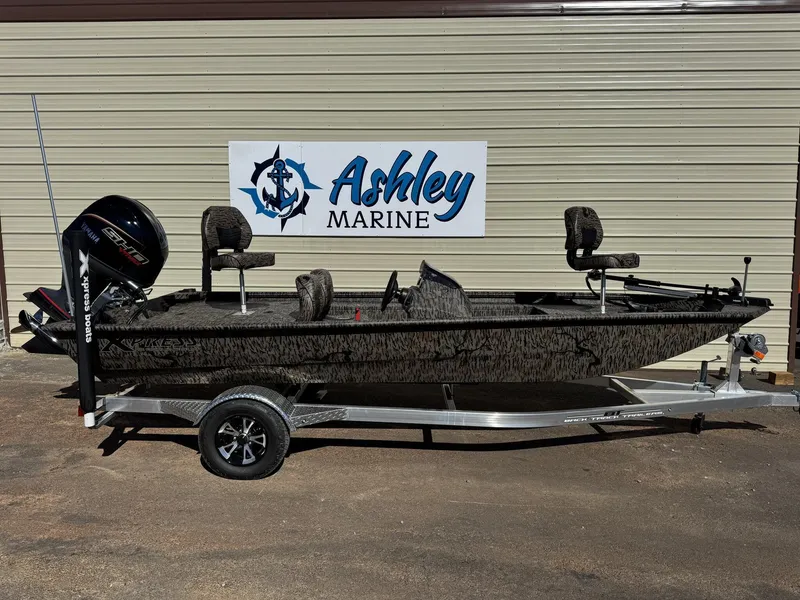 Slide: The Image of 2026 Xpress XP180 boat on trailer at Ashley Marine dealership. - 1