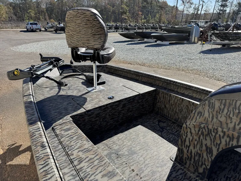 Slide: The Image of 2026 Xpress XP180 boat with camo design, featuring a swivel seat and trolling motor. - 4