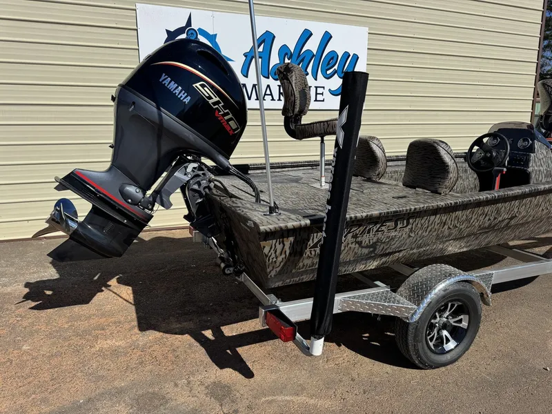 Slide: The Image of 2026 Xpress XP180 boat with Yamaha motor, parked at Ashley Marine. - 7