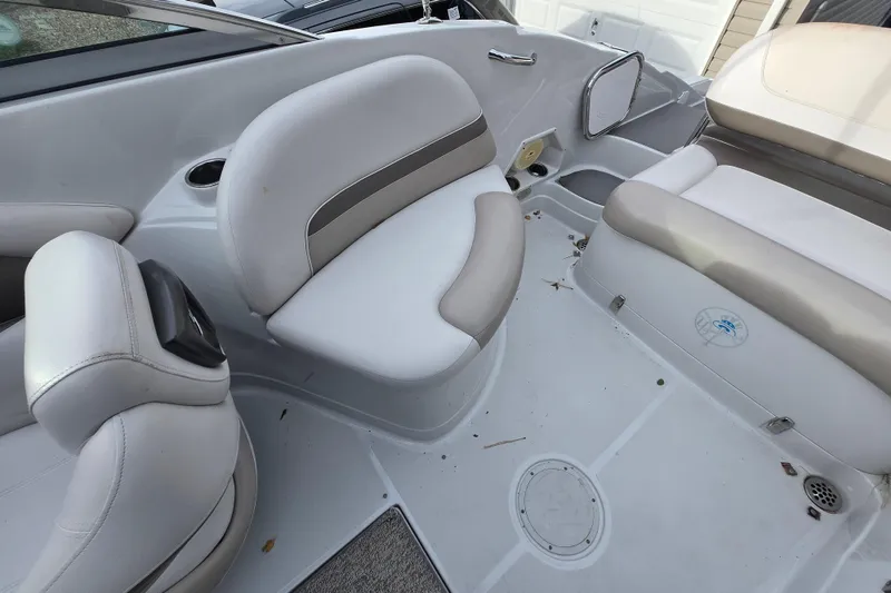 Slide: The Image of 2012 Crownline Eclipse E4 boat interior with white and gray seating. - 14