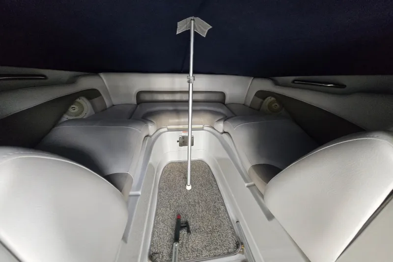 Slide: The Image of Interior of 2012 Crownline Eclipse E4 boat with seating and carpeted floor. - 17