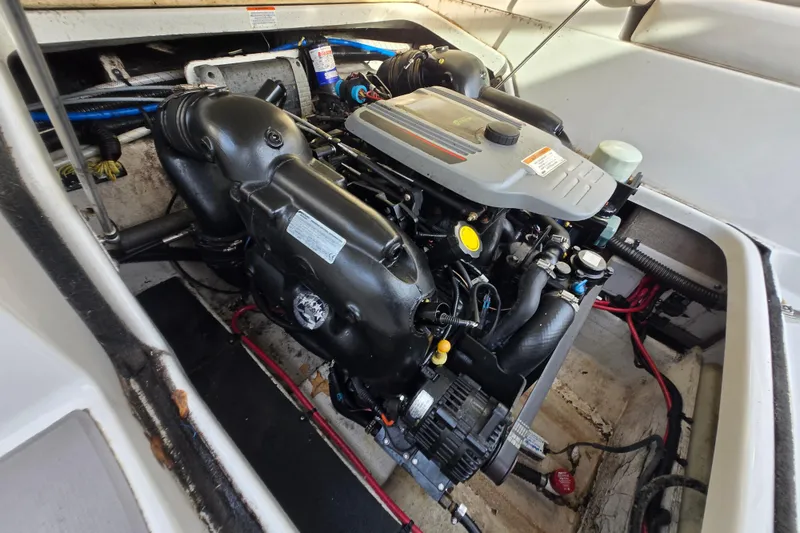 Slide: The Image of Engine compartment of a 2012 Crownline Eclipse E4 boat, showcasing detailed components. - 25