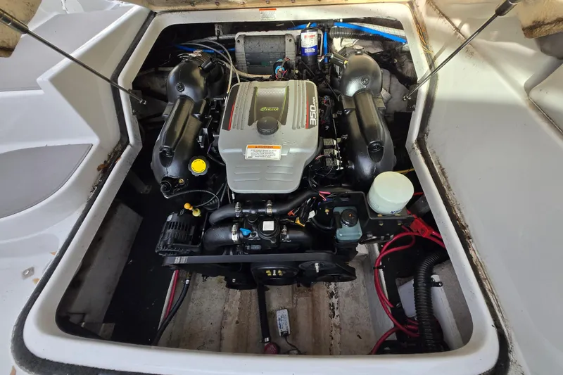Slide: The Image of Engine compartment of a 2012 Crownline Eclipse E4 boat, featuring a 350 horsepower engine. - 7