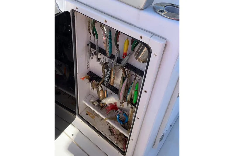 Slide: The Image of 1999 Boston Whaler 21 Outrage boat dashboard with steering wheel and controls. - 12