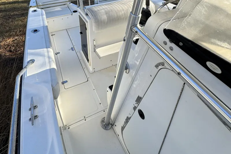 Slide: The Image of 1999 Boston Whaler 21 Outrage boat interior with seating and storage compartments. - 24