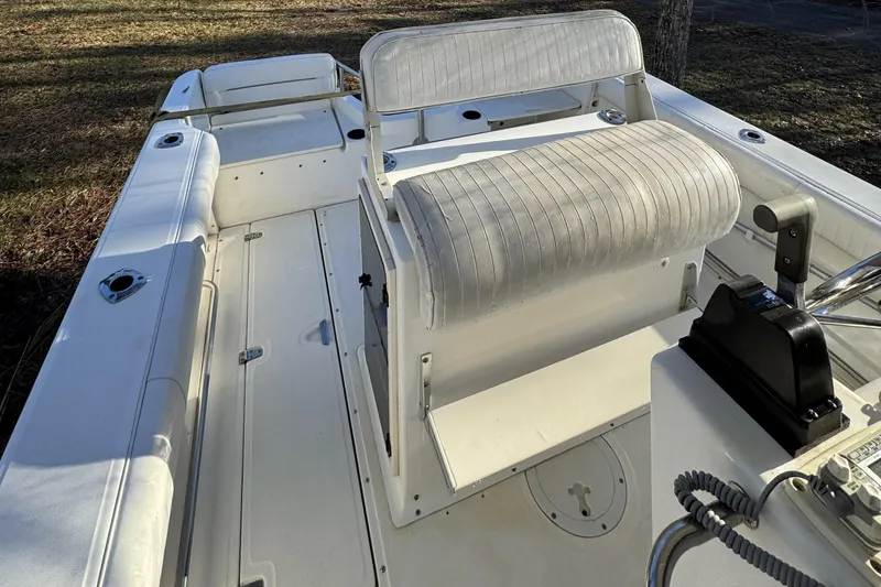 Slide: The Image of 1999 Boston Whaler 21 Outrage boat interior with seating and control console. - 26