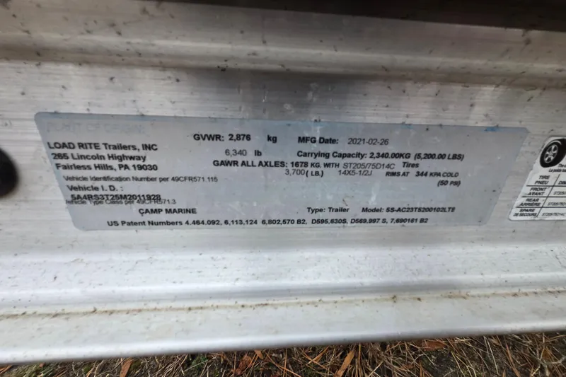 Slide: The Image of Label on Load Rite trailer, detailing specifications and manufacturing information. - 33