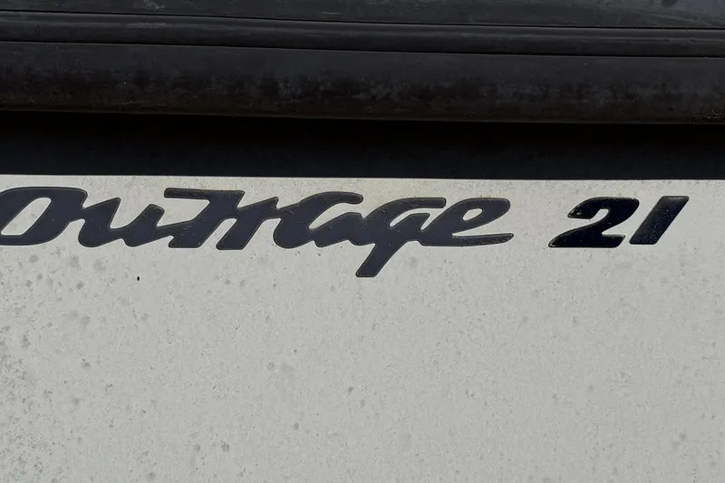 Slide: The Image of Close-up of 1999 Boston Whaler 21 Outrage boat logo on hull. - 34