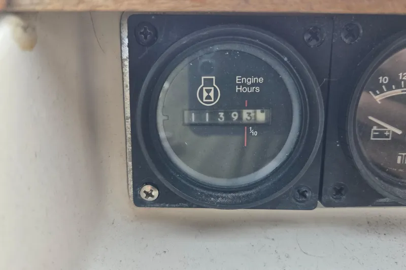 Slide: The Image of 1987 Silverton 34X Express engine hour meter showing 1393 hours. - 11