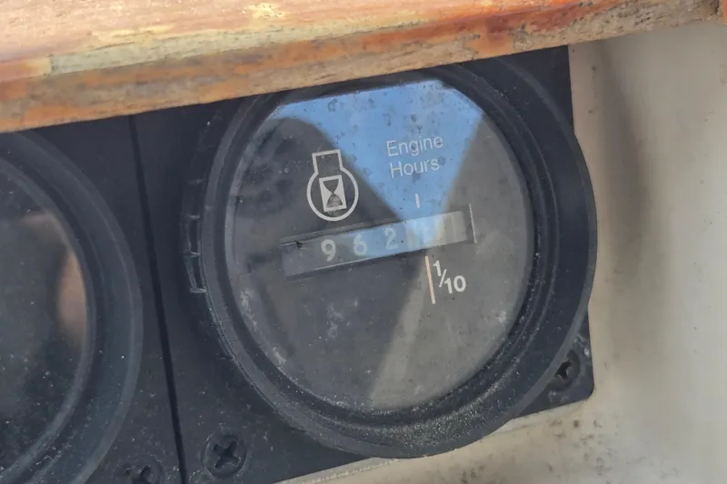 Slide: The Image of Engine hour meter showing 962 hours on 1987 Silverton 34X Express boat. - 12