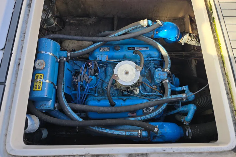 Slide: The Image of 1987 Silverton 34X Express engine compartment with blue Crusader Marine engine. - 15