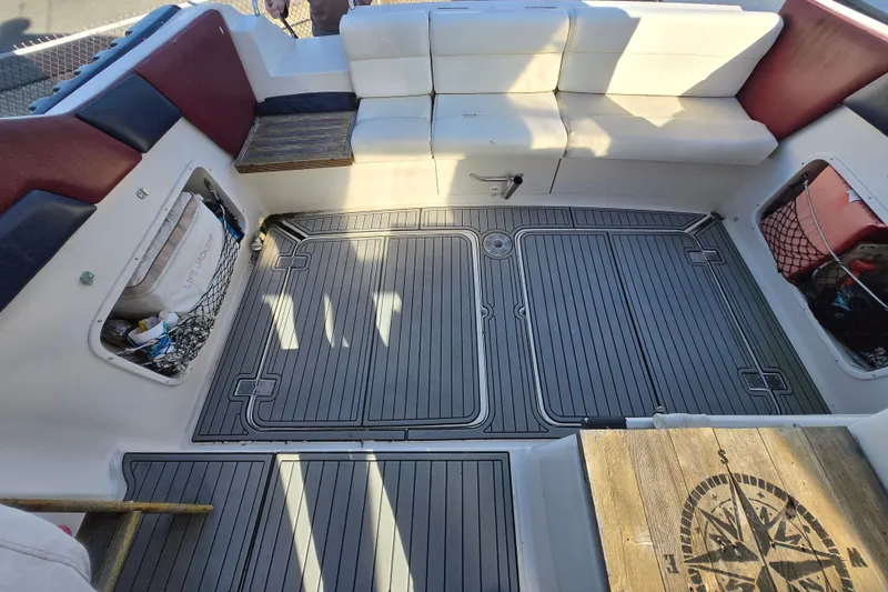 Slide: The Image of 1987 Silverton 34X Express boat interior with seating and storage compartments. - 7