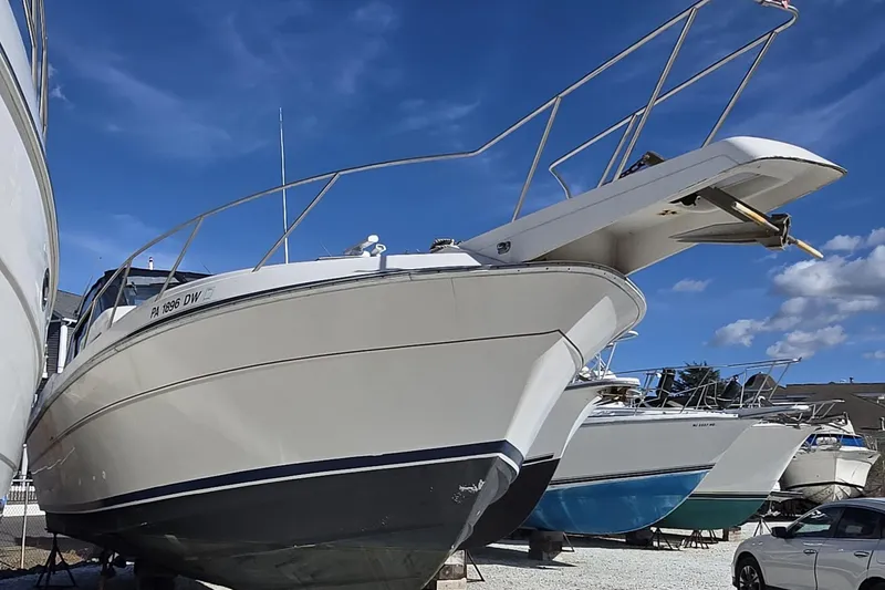 Slide: The Image of 1987 Silverton 34X Express boat on land under a clear blue sky. - 9