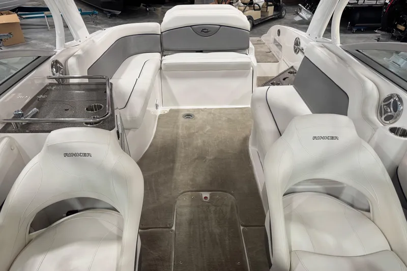 Slide: The Image of 2010 Rinker 296 Captiva Bowrider interior with white seating and gray accents. - 11
